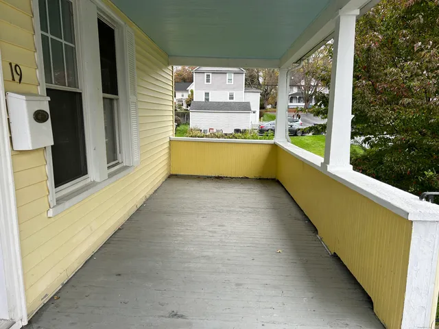a view of balcony with furniture