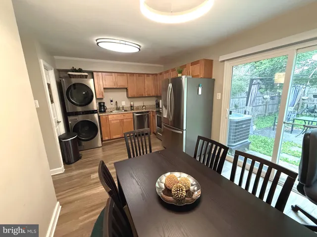a view of a dining room with furniture wooden floor and carpet