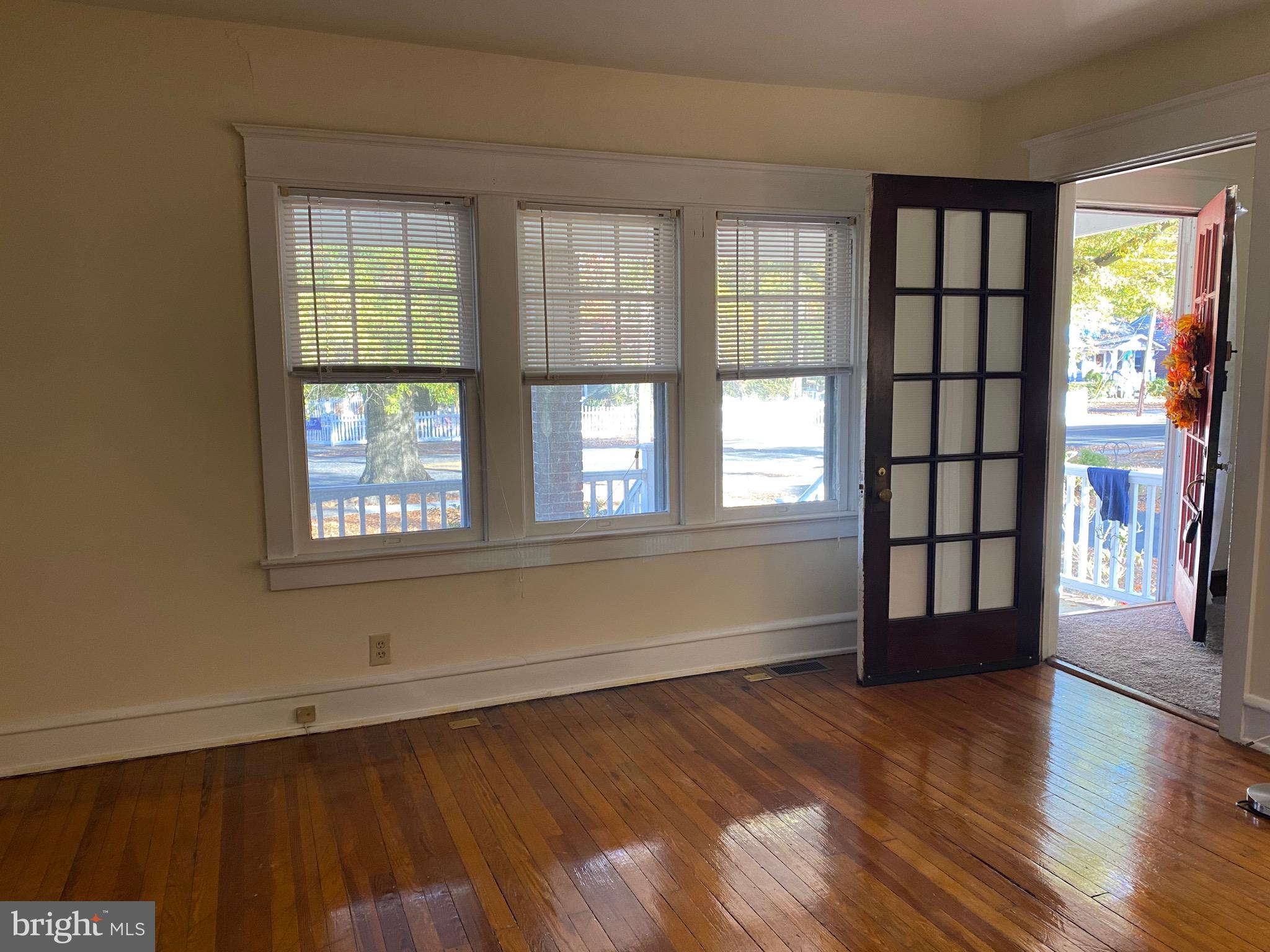 712 Grove Street Haddonfield, NJ 08033 - Photo 2 of 18 an empty room with wooden floor and windows