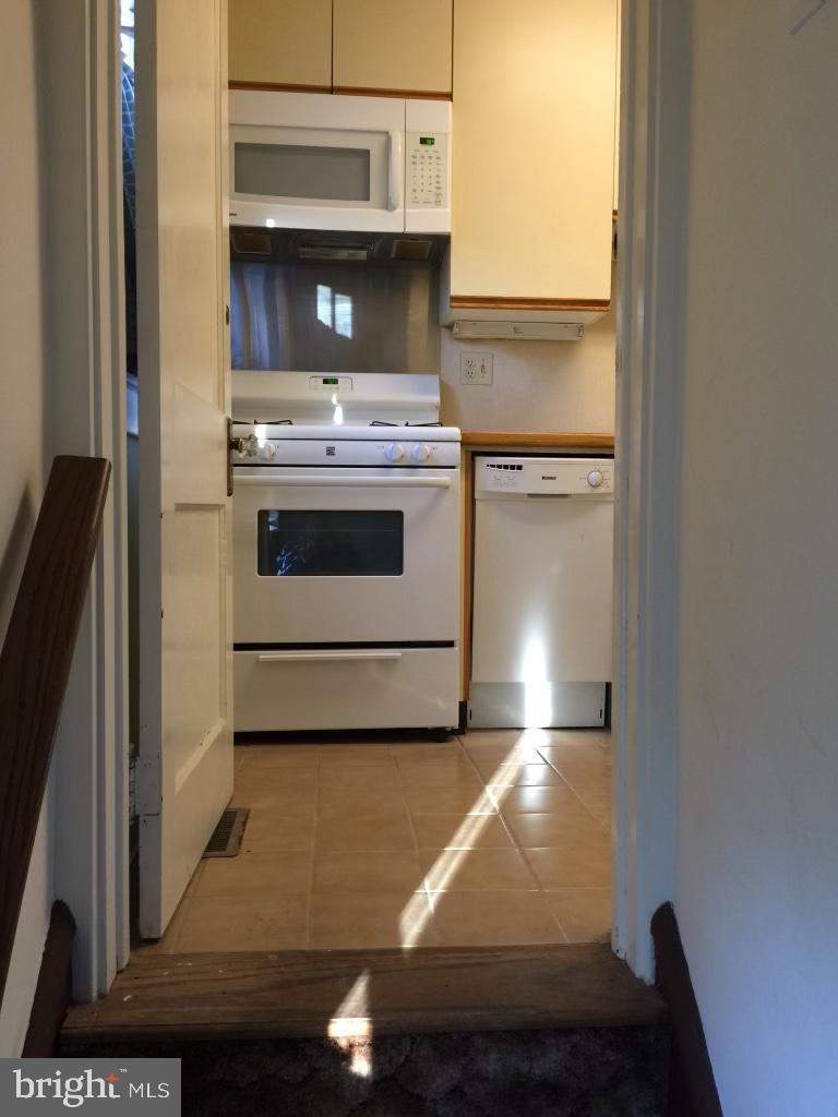 712 Grove Street Haddonfield, NJ 08033 - Photo 4 of 18 a kitchen with a stove and a microwave