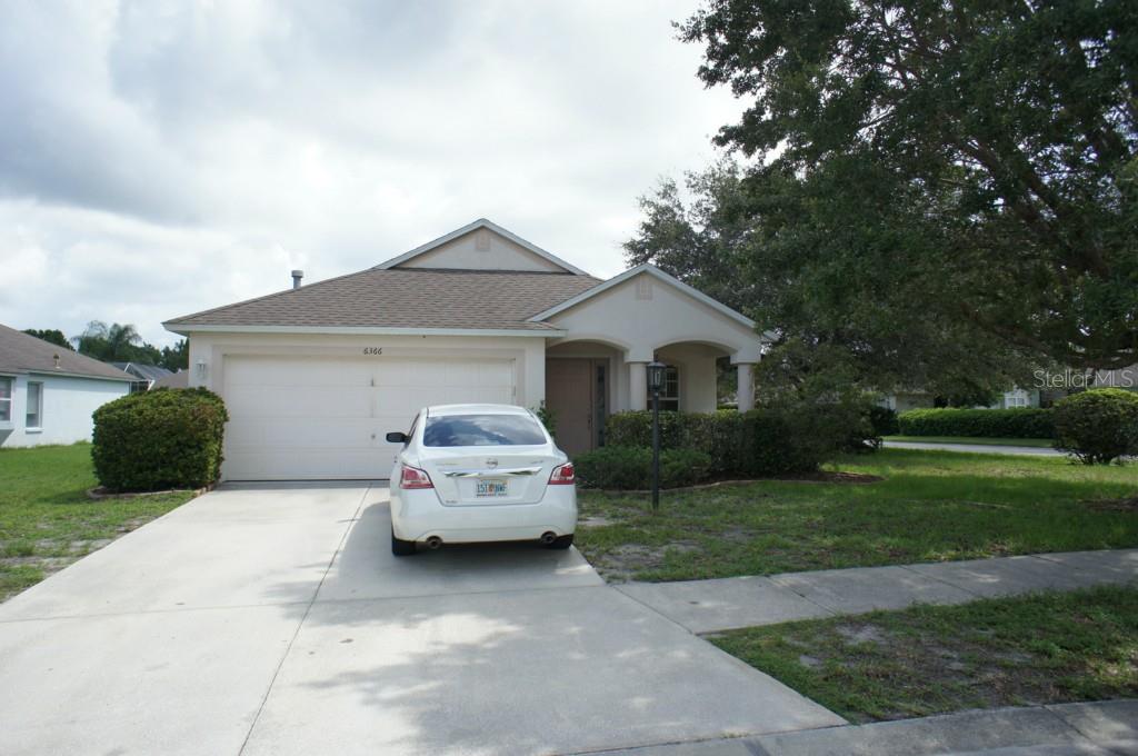 6366 Yellowtop Drive Lakewood Ranch, FL 34202 - Photo 1 of 1 a car parked in front of white house