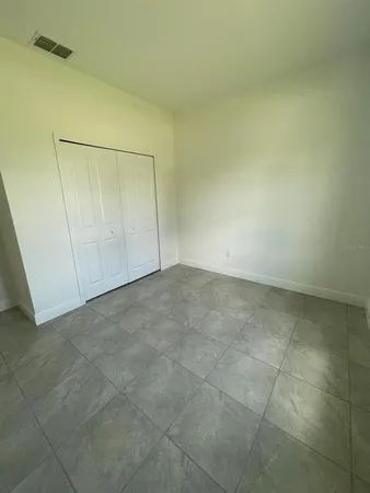 an empty room with a bathroom