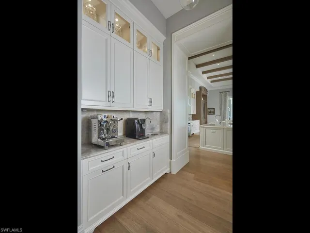 a view of a kitchen with wooden floor