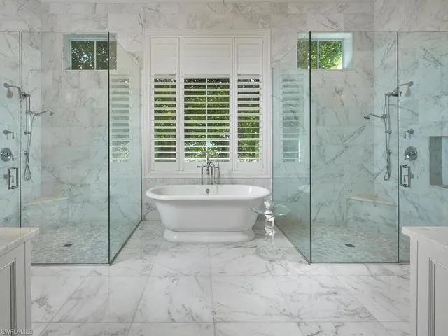 a bathroom with a bathtub and shower