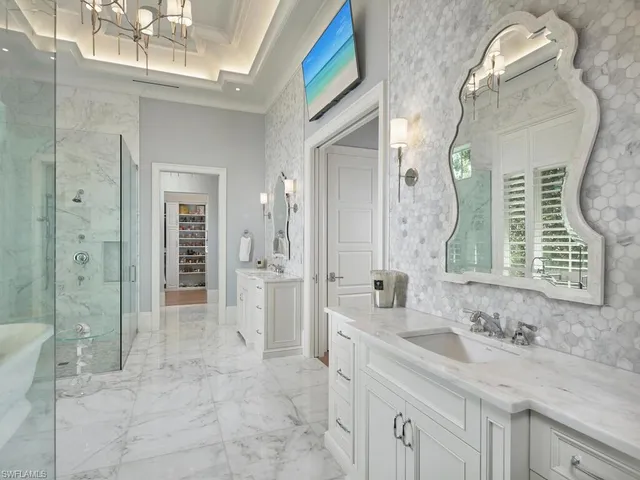 a bathroom with a granite countertop sink mirror and double