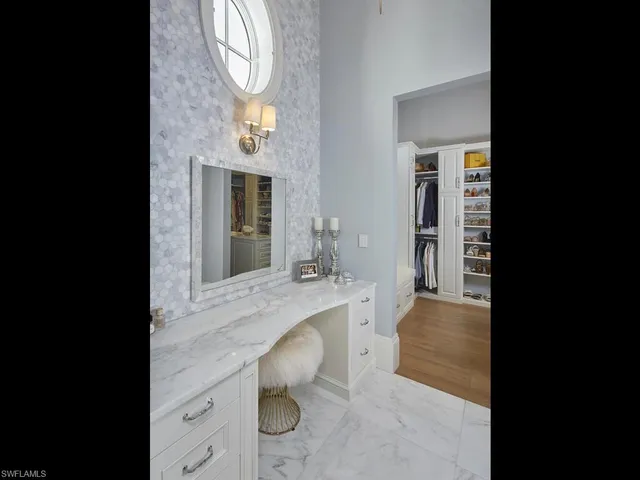 a bathroom with a sink a mirror and a bathtub
