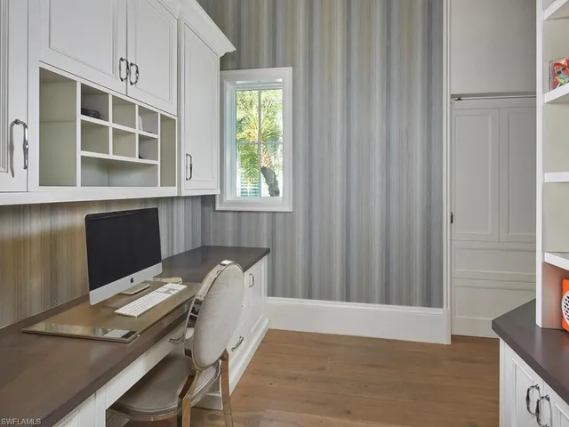 a workspace with furniture and window