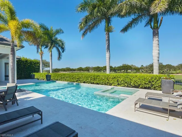 a view of a patio with a table and chairs