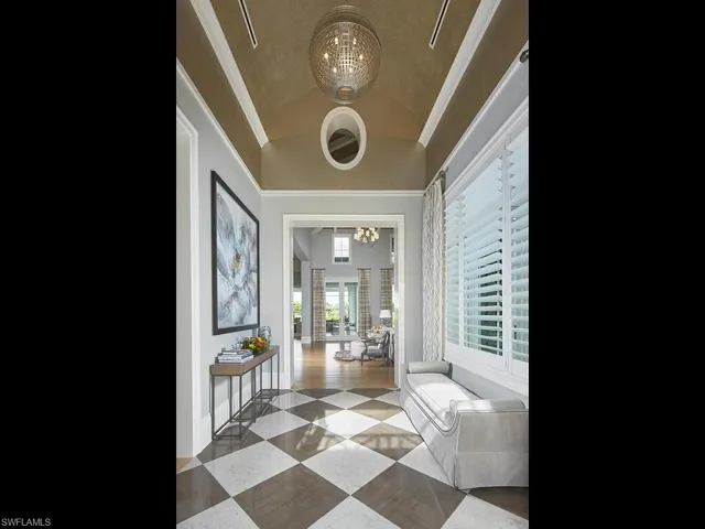 a view of a hallway with windows