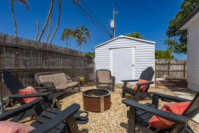 a backyard of a house with seating space