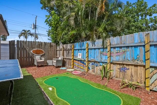 a bedroom with two beds and a flat screen tv