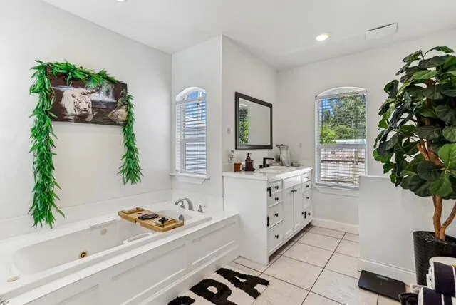 a living room with stainless steel appliances kitchen island granite countertop furniture and a window