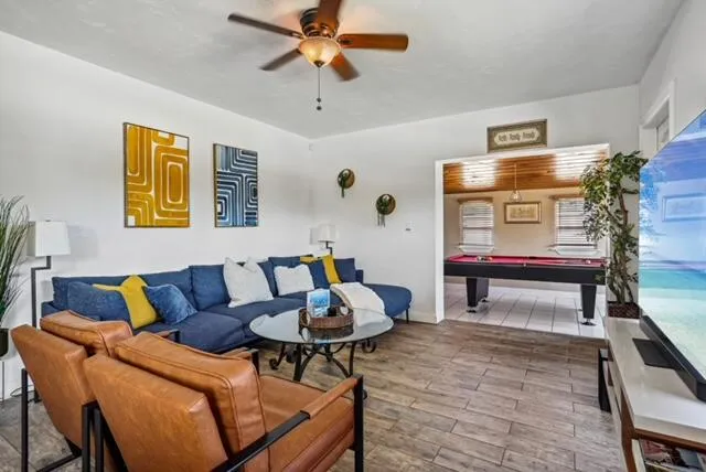 a living room with furniture and a flat screen tv