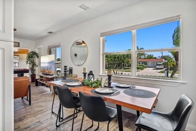 a view of a dining room with furniture window and outside view