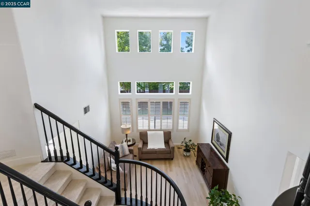 a view of a porch with wooden floor and windows