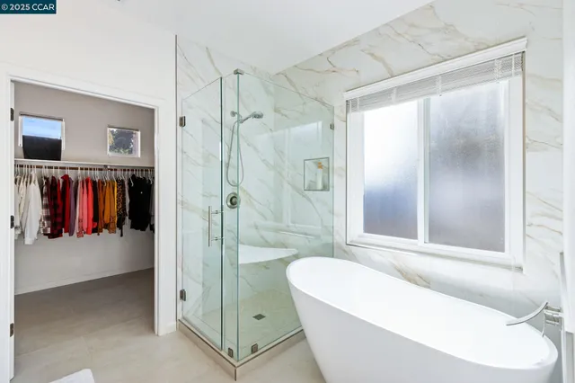 a bathroom with a tub and a shower
