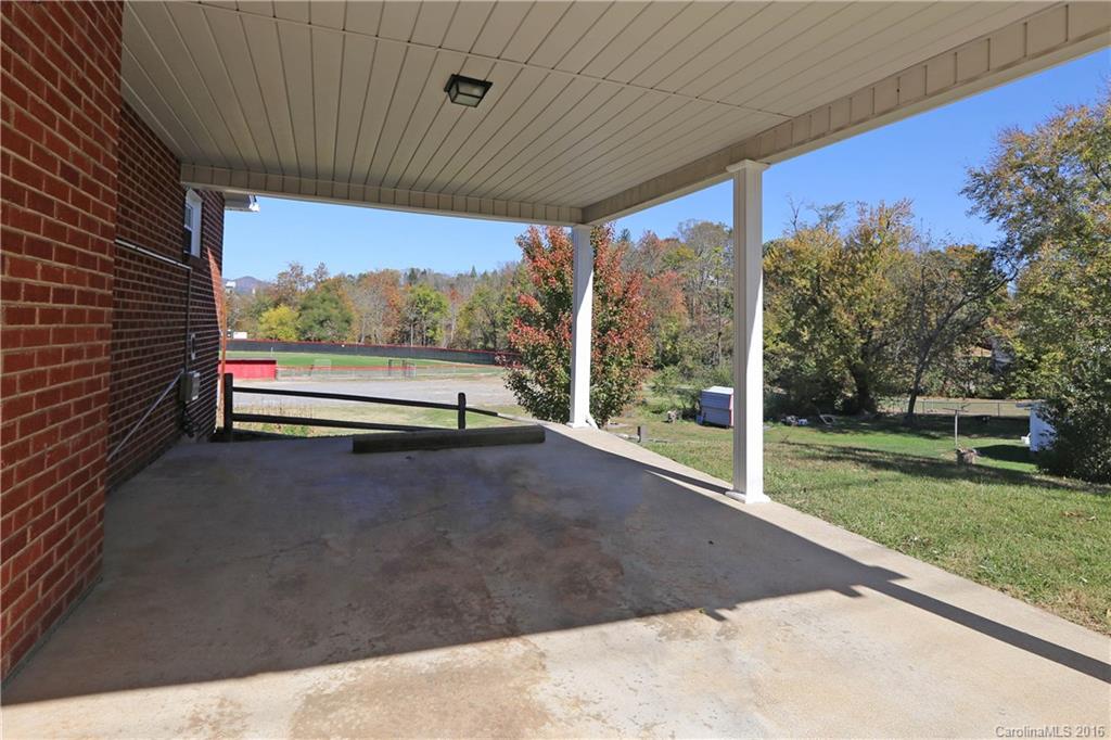 46 Substation Road Canton, NC 28716 - Photo 14 of 19 a view of a floor to ceiling window with backyard view