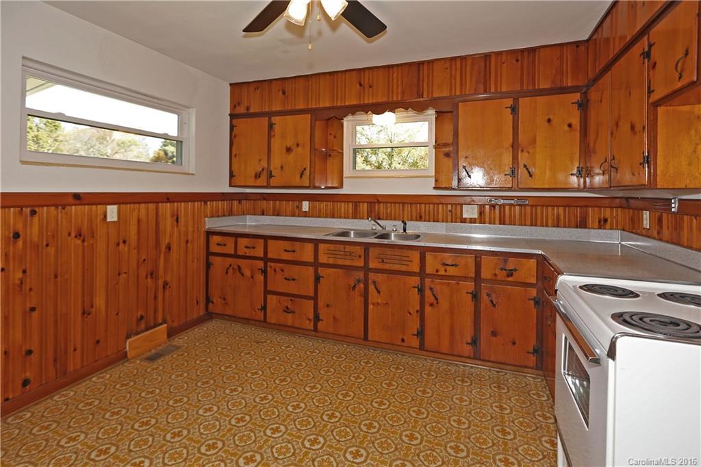 46 Substation Road Canton, NC 28716 - Photo 8 of 19 a kitchen with stainless steel appliances granite countertop a stove a sink and a microwave