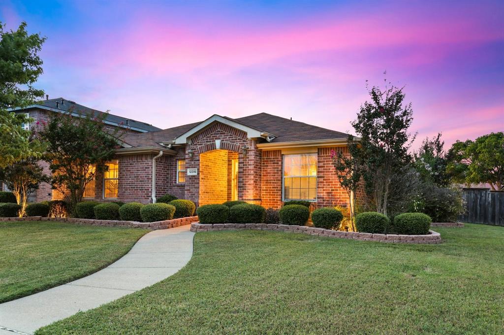 12316 Foothill Lane Frisco, TX 75035 - Photo 1 of 1 a front view of a house with garden