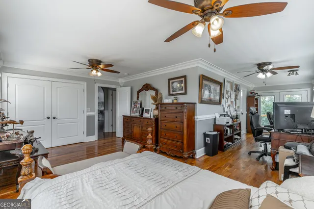 a view of walk in closet with clothes