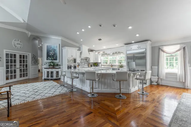 a living room with fireplace furniture and a wooden floor