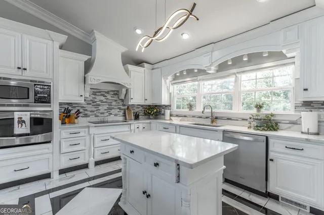 a room with lots of potted plants and white walls