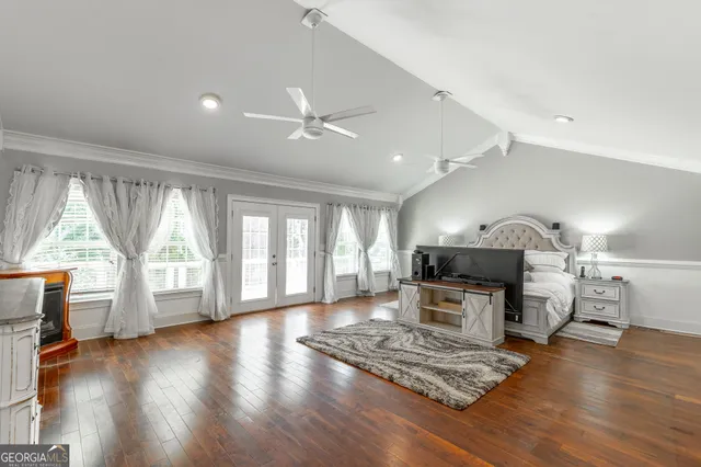 a view of a house with a yard and sitting area
