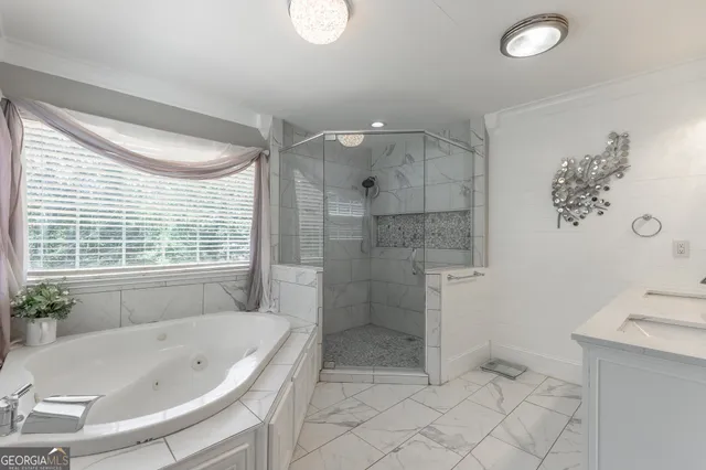 a view of a house with a yard and potted plants