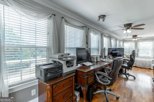 a view of balcony with two large trees