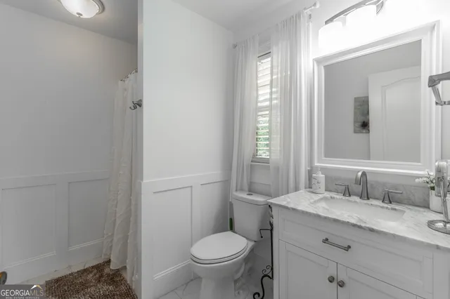 a view of a balcony with trees