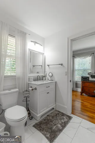 a view of a house with a yard porch and sitting area