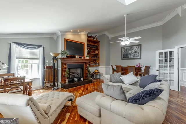 a aerial view of a house with a yard table and chairs