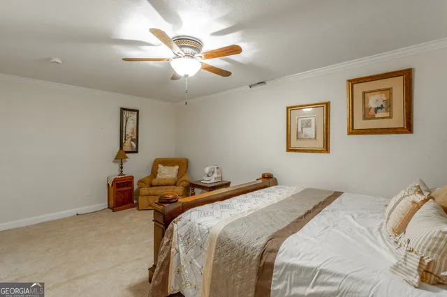 a aerial view of residential houses with outdoor space and trees