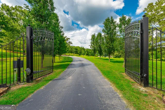 a living room with fireplace furniture and a wooden floor