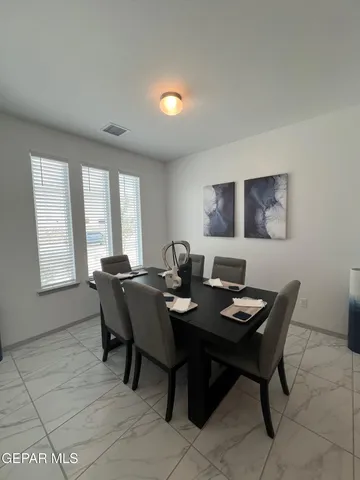 a view of a dining room with furniture