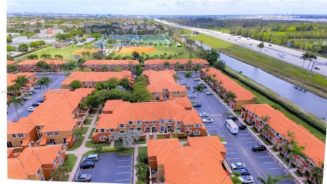 an aerial view of residential houses with outdoor space