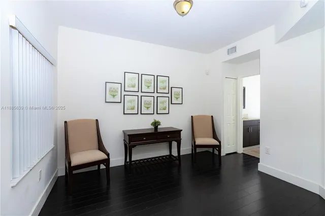 a view of a livingroom with furniture and wooden floor