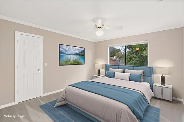 a bedroom with a large bed and a window