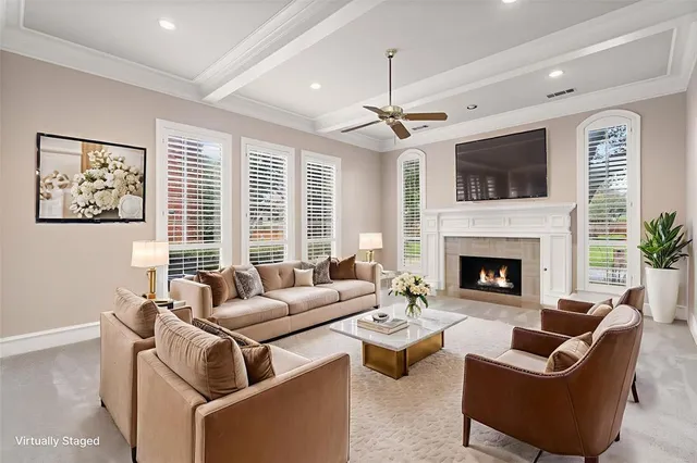 a living room with furniture fireplace and flat screen tv