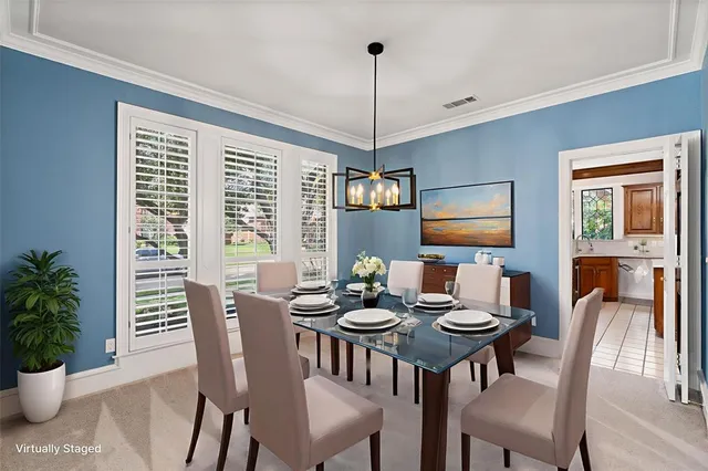 a view of a dining room with furniture window and outside view