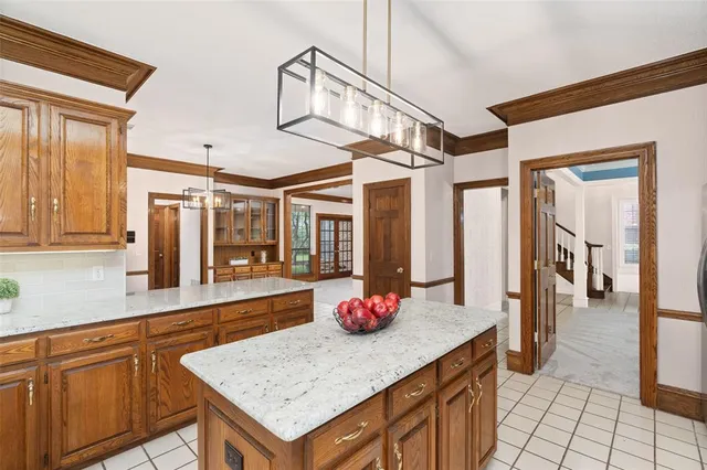 a kitchen with stainless steel appliances granite countertop a sink and cabinets