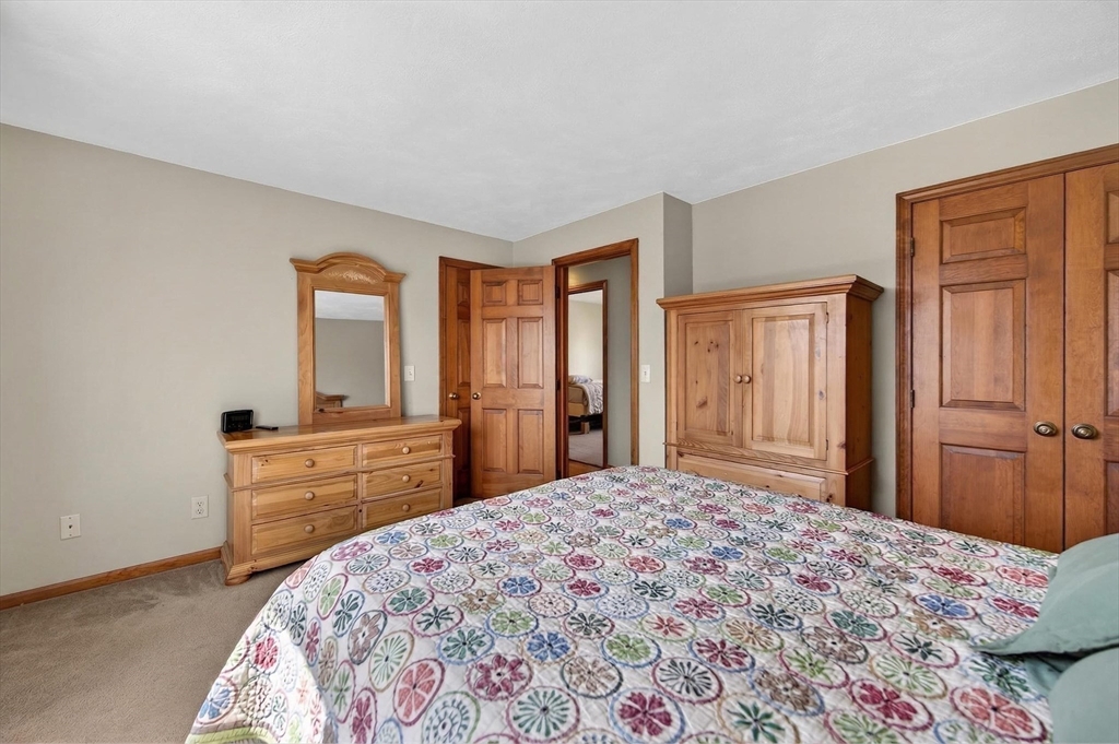 1079 Langley Street Fall River, MA 02720 - Photo 17 of 40 a bedroom with a bed and a dresser