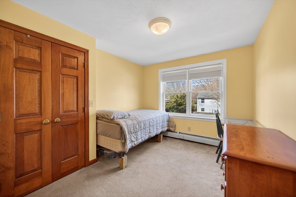 1079 Langley Street Fall River, MA 02720 - Photo 19 of 40 a room with a bed and a window