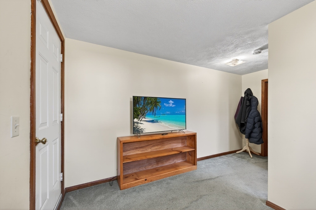 1079 Langley Street Fall River, MA 02720 - Photo 22 of 40 a view of room with furniture and a fan