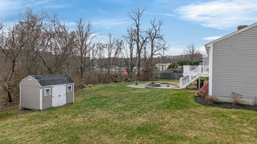 1079 Langley Street Fall River, MA 02720 - Photo 32 of 40 a view of a garden with a slide