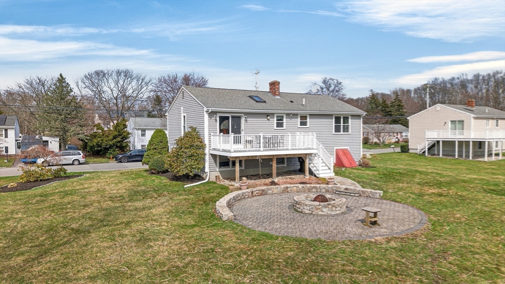 1079 Langley Street Fall River, MA 02720 - Photo 35 of 40 a view of a house with a big yard and large trees