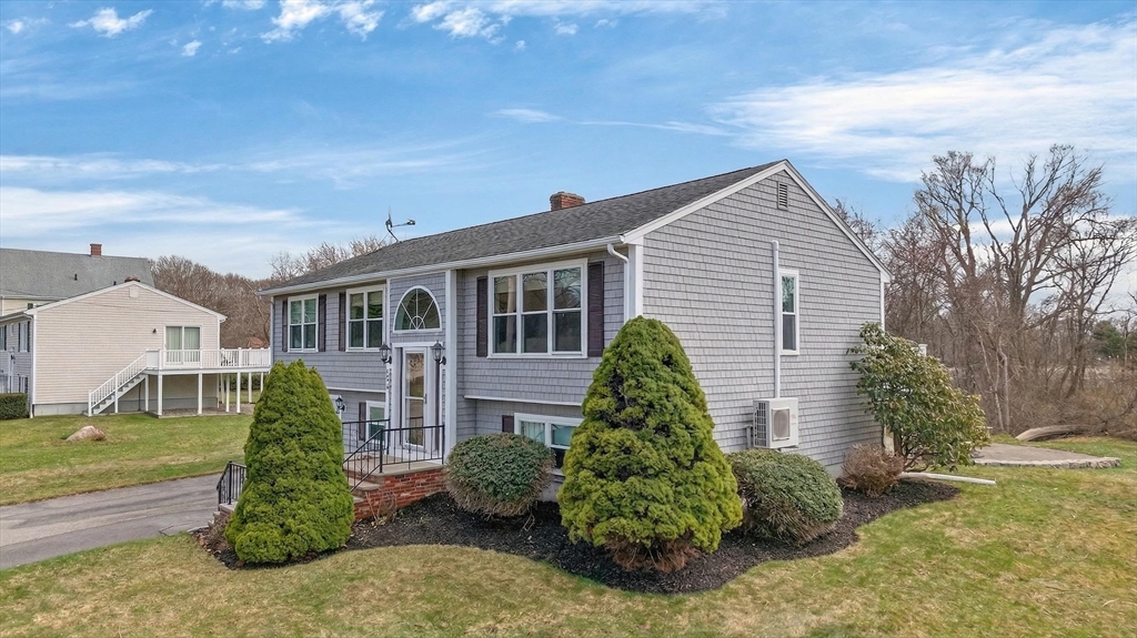 1079 Langley Street Fall River, MA 02720 - Photo 5 of 40 a front view of a house with garden