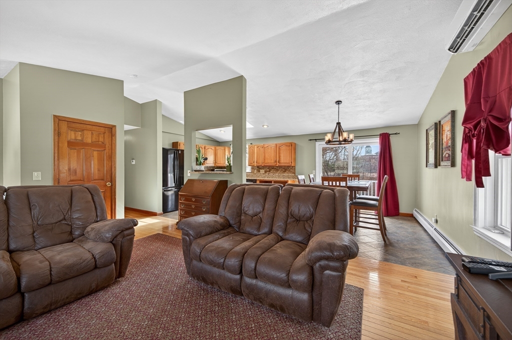 1079 Langley Street Fall River, MA 02720 - Photo 9 of 40 a living room with furniture and a wooden floor