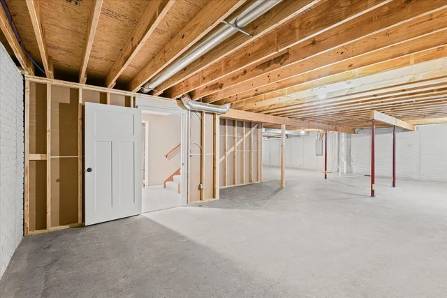 a view of empty room with wooden walls