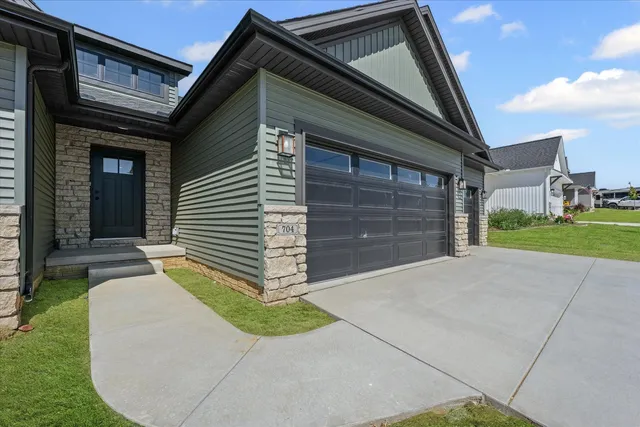a backyard of a house with garden and entertaining space